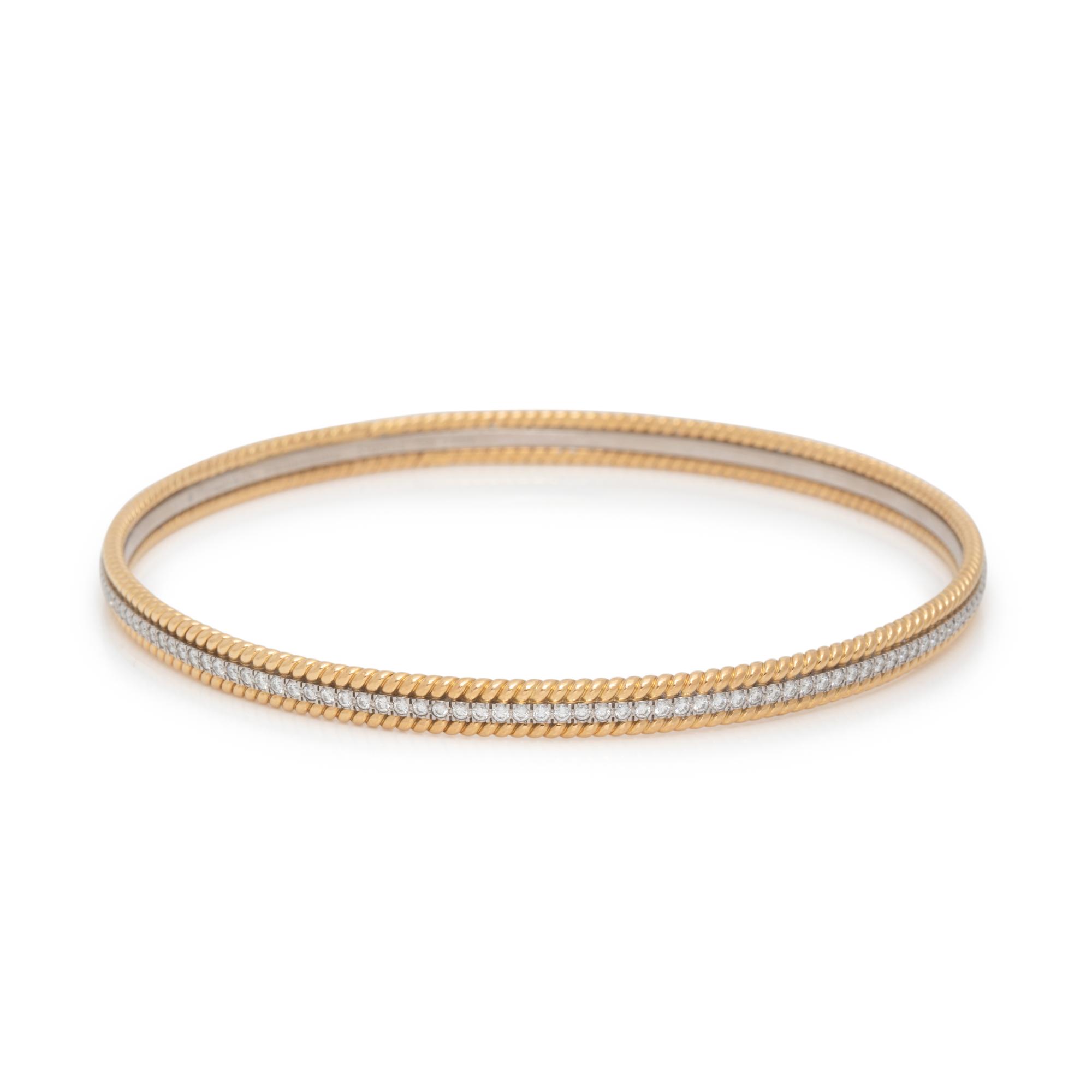 TIFFANY & CO., SCHLUMBERGER, YELLOW GOLD, PLATINUM AND DIAMOND 'ROPE' BANGLE BRACELET