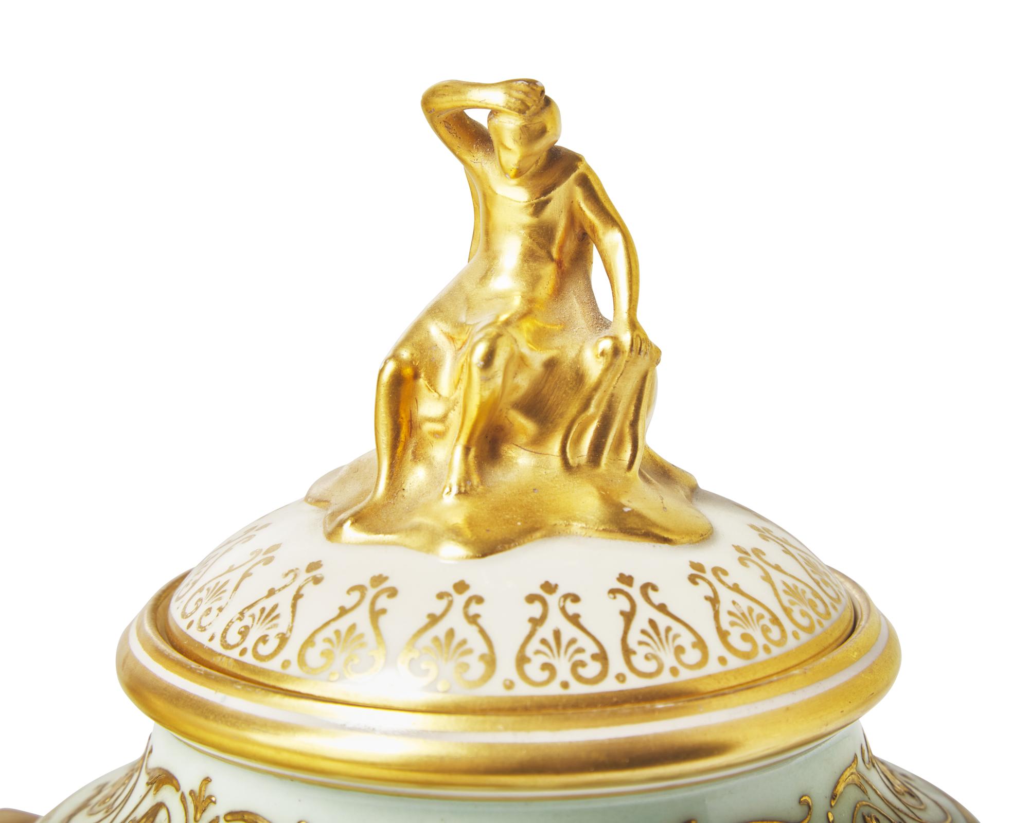 A Pair of Wedgwood Parcel Gilt Porcelain 'Victoria' Vases and Covers