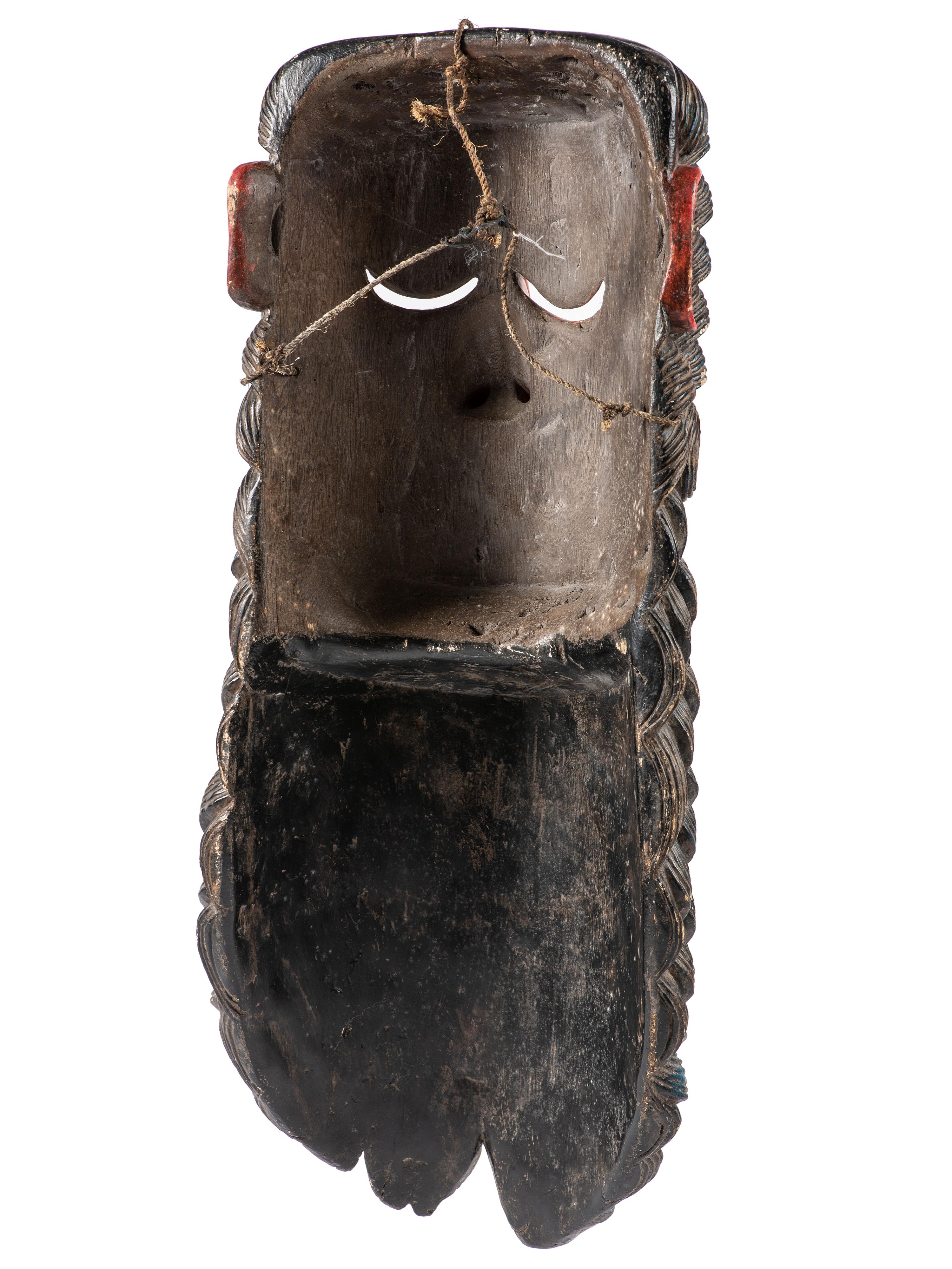 A Mexican Carved and Painted Wood Festival Mask