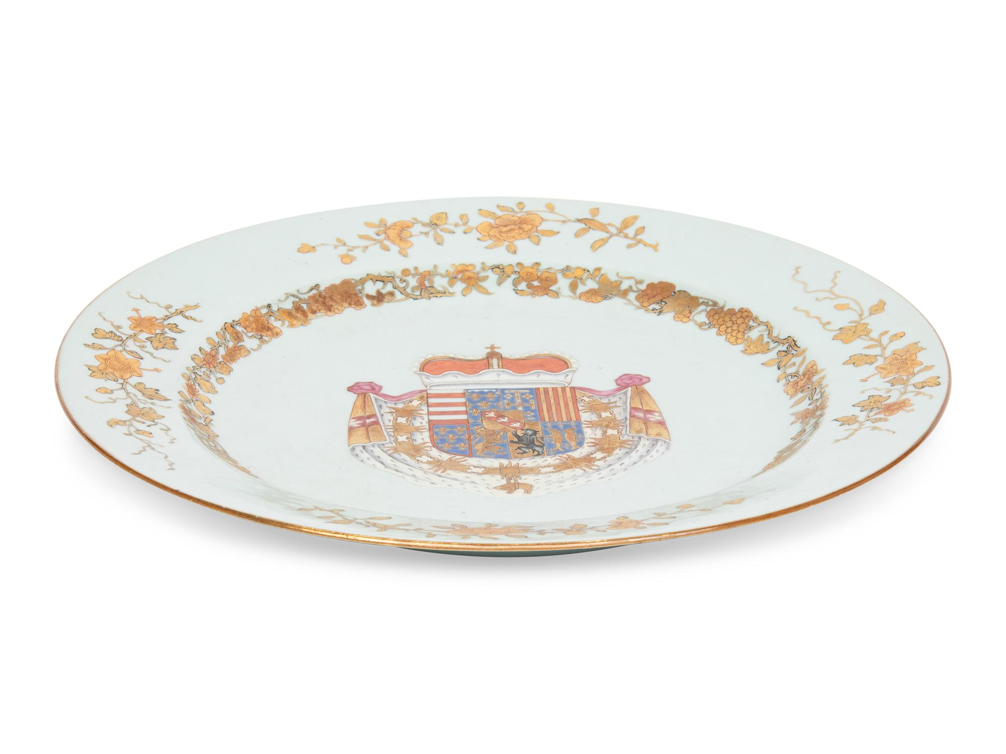 A Chinese Export Parcel-Gilt Armorial Porcelain Charger