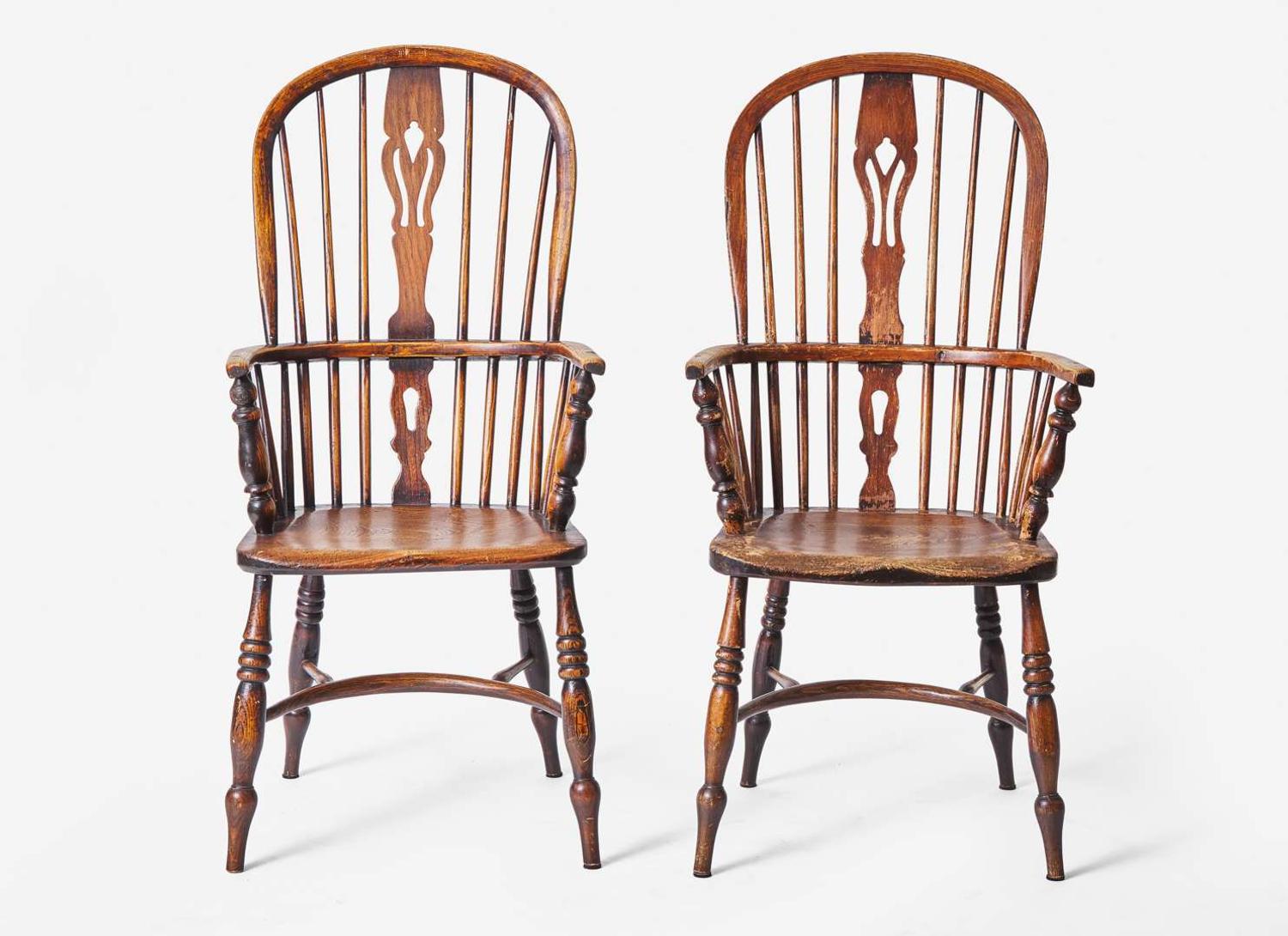 A pair of English provincial carved elm and ash Windsor armchairs, 19th century