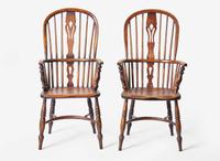 A pair of English provincial carved elm and ash Windsor armchairs, 19th century