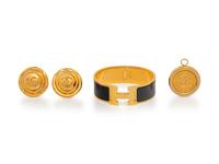 A Group of Three Costume Jewelry Pieces by Hermès and Chanel