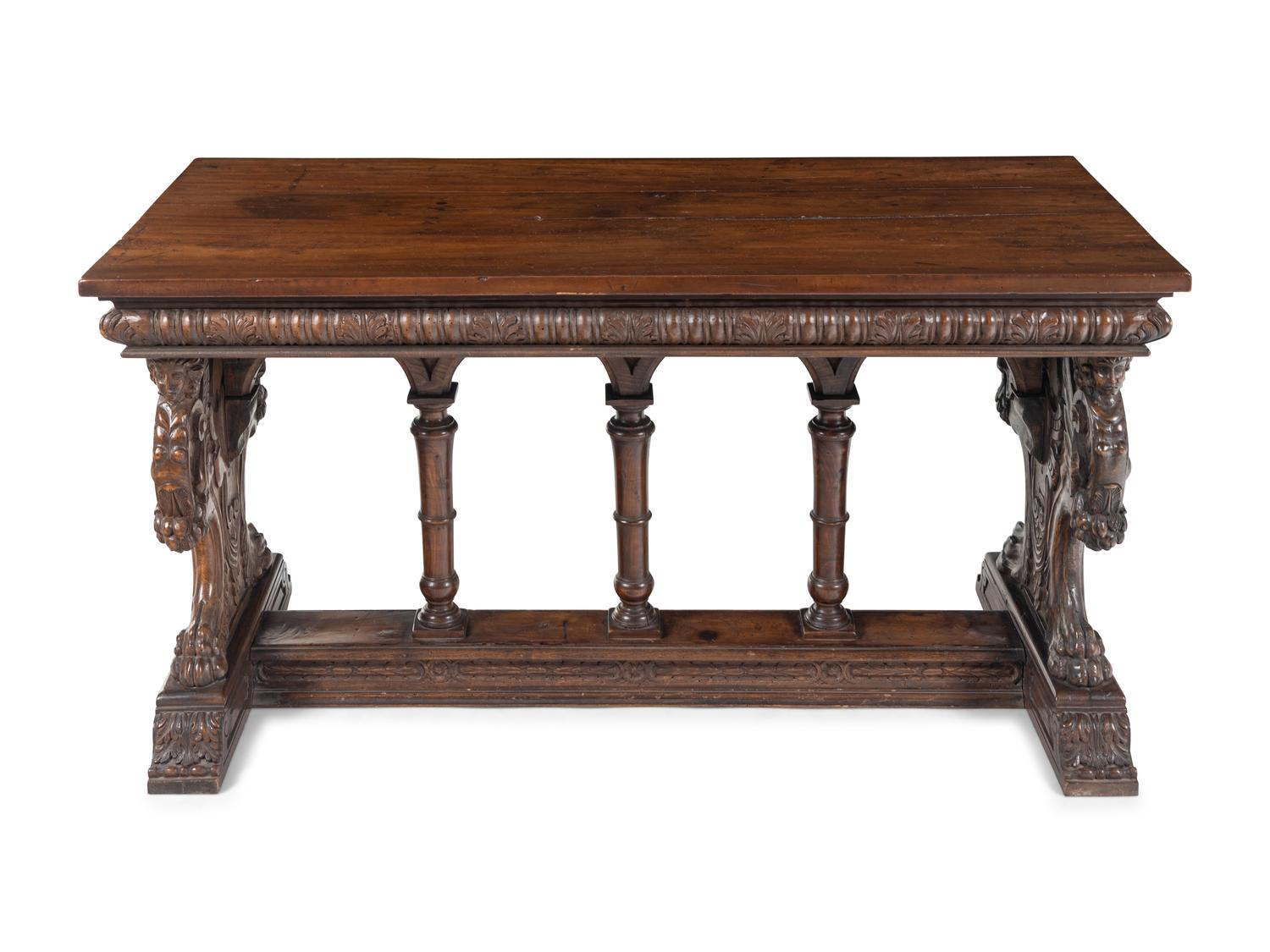 A Florentine Renaissance Style Carved Walnut Trestle Table