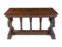 A Florentine Renaissance Style Carved Walnut Trestle Table