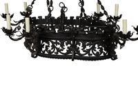 A Wrought Iron Chandelier in the Style of Addison Mizner — 20th Century
