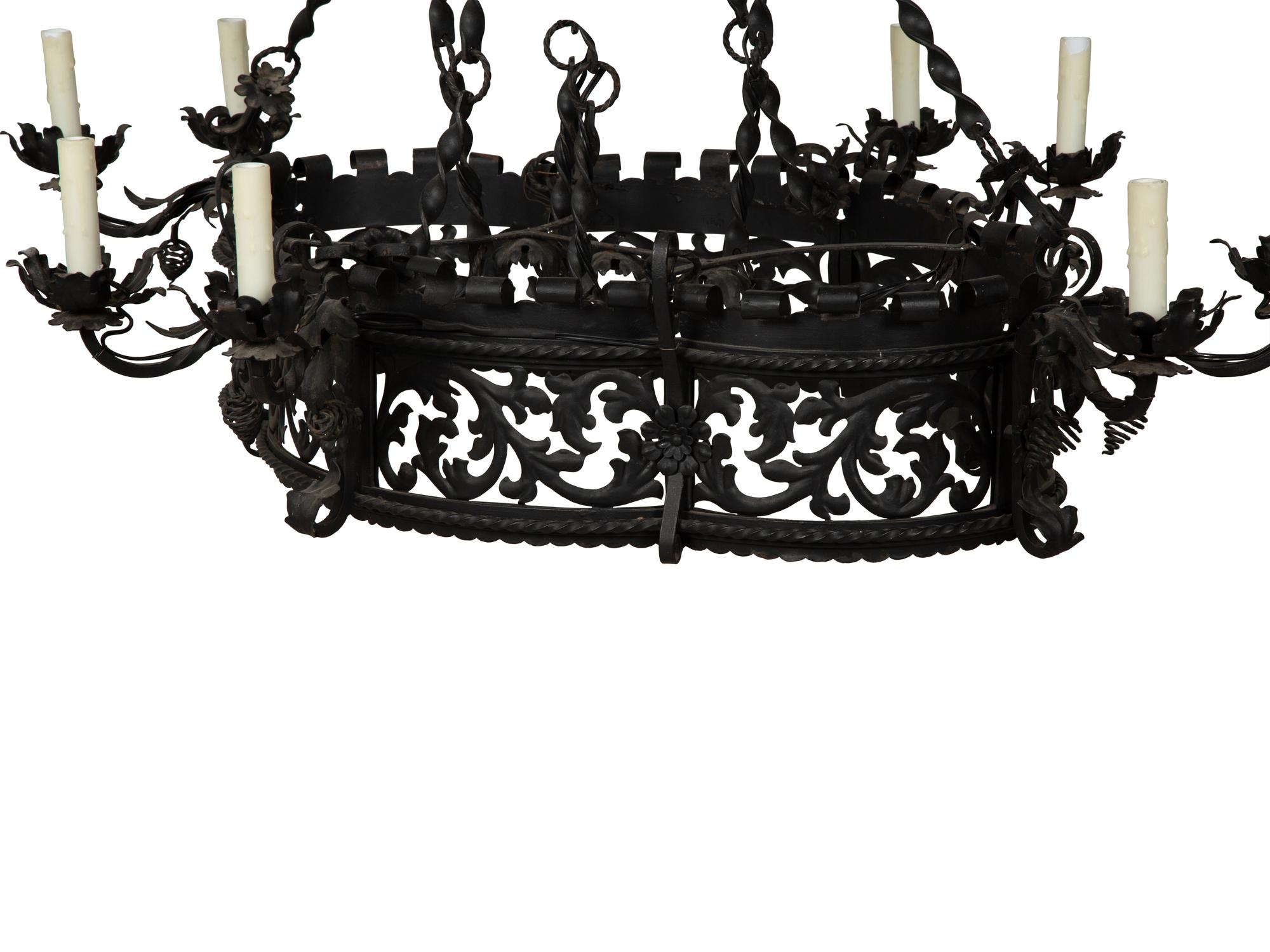 A Wrought Iron Chandelier in the Style of Addison Mizner — 20th Century