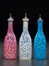 Three Coral Opalescent Glass Barber's Bottles