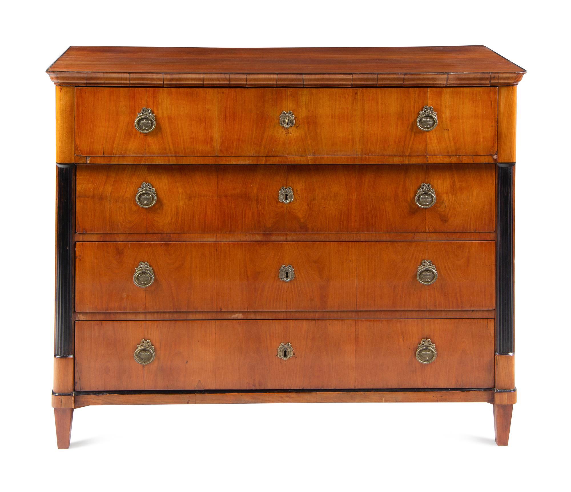 An Austrian Neoclassical Part-Ebonized Walnut Commode