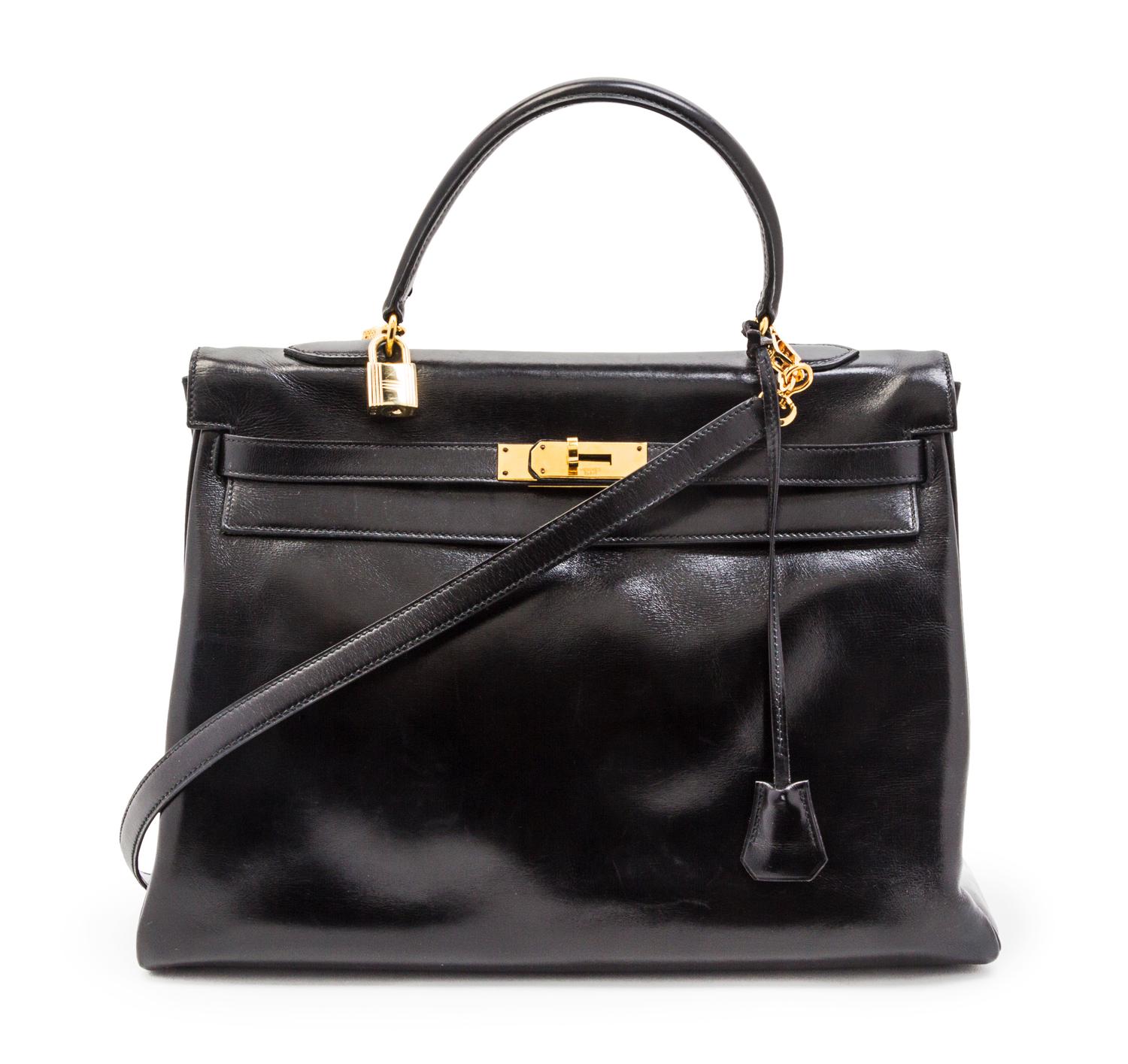 An Hermes 35cm Black Leather Kelly Bag, 14 x 8 x 7 inches.