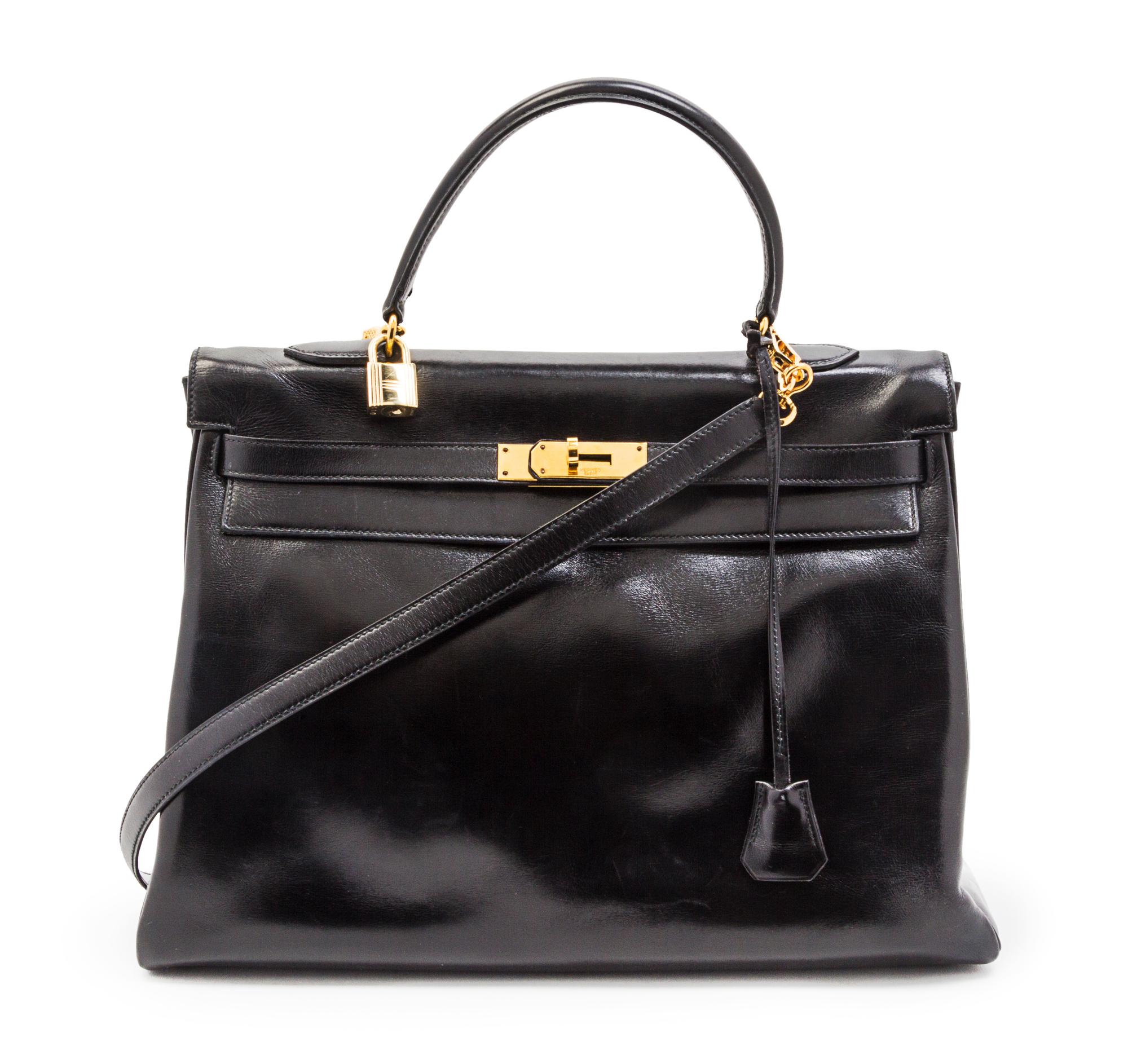 An Hermes 35cm Black Leather Kelly Bag, 14 x 8 x 7 inches.