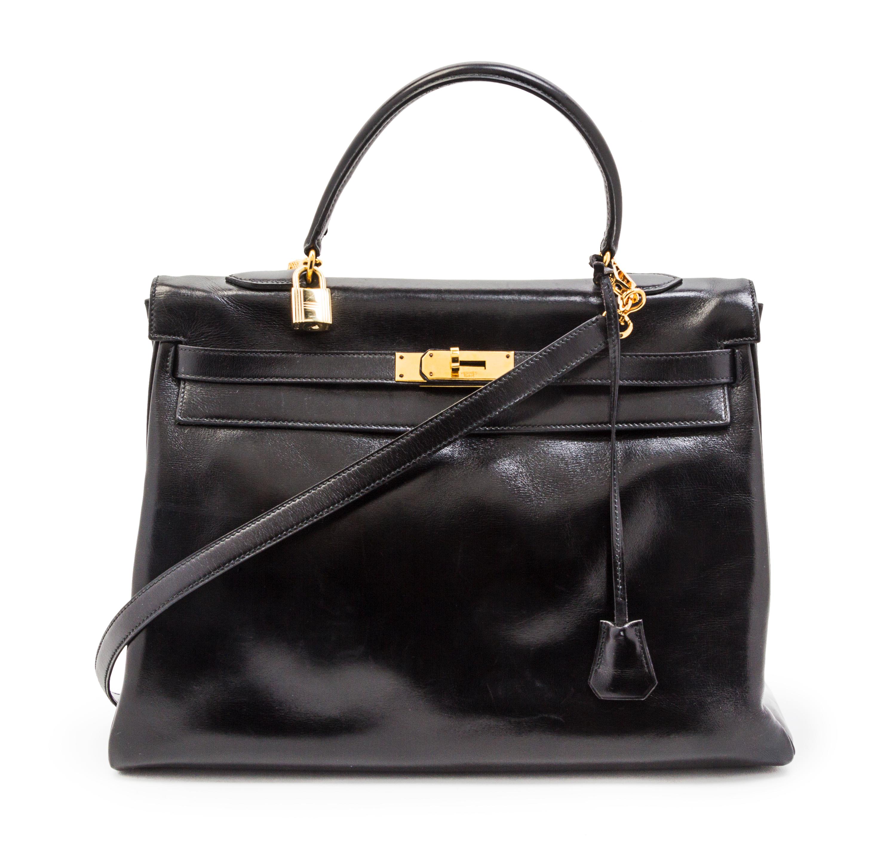An Hermes 35cm Black Leather Kelly Bag, 14 x 8 x 7 inches.