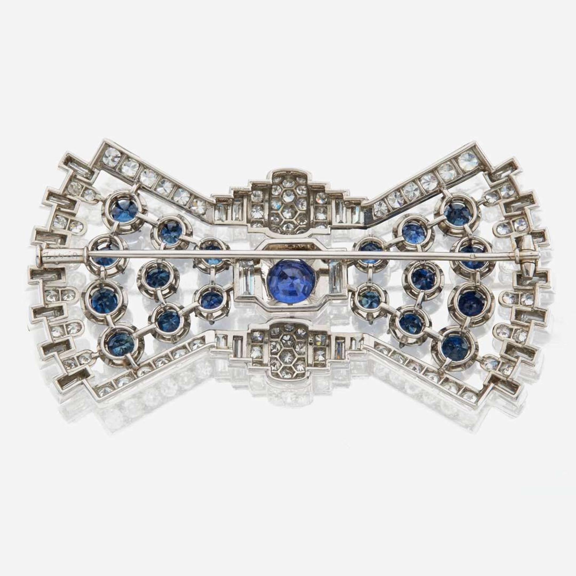A diamond, sapphire, and platinum brooch