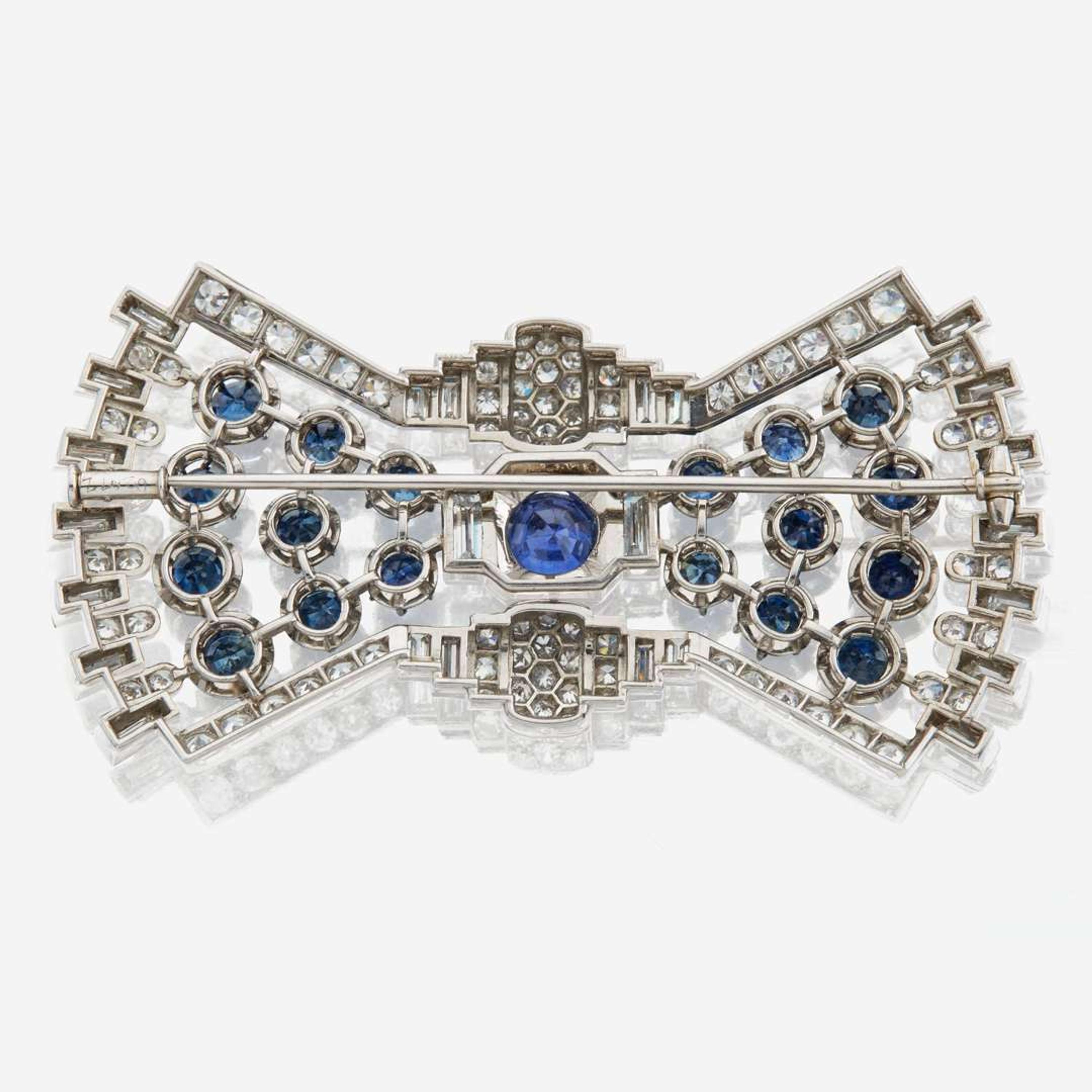 A diamond, sapphire, and platinum brooch