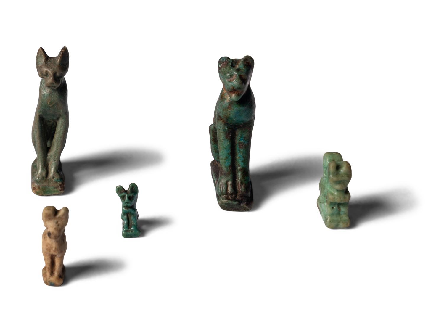 Eight Egyptian Faience Bastet Amulets