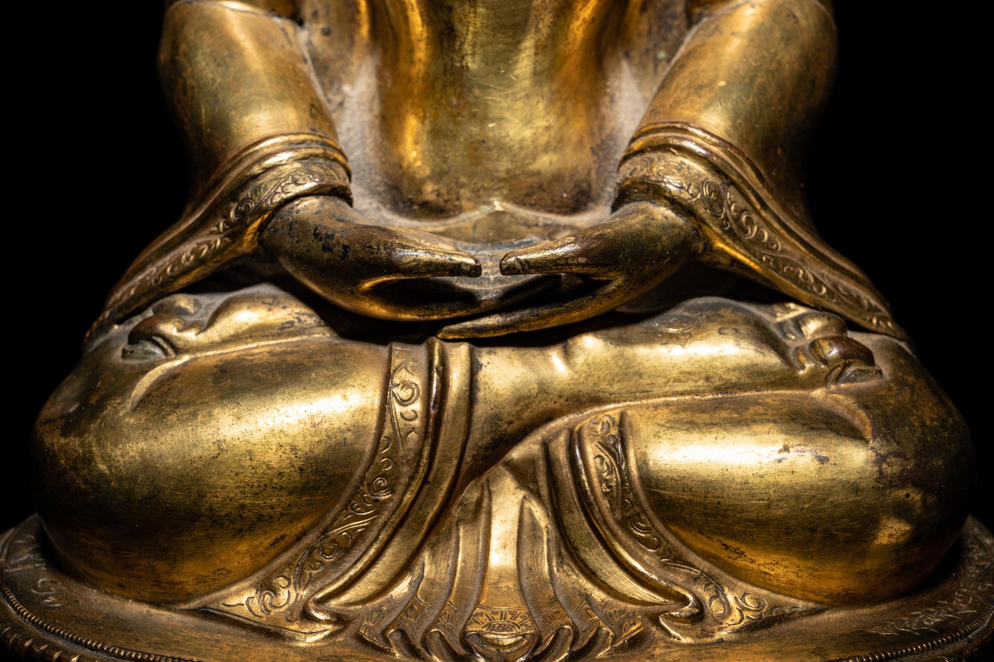 A Large Tibetan Gilt Bronze Figure of Seated Buddha