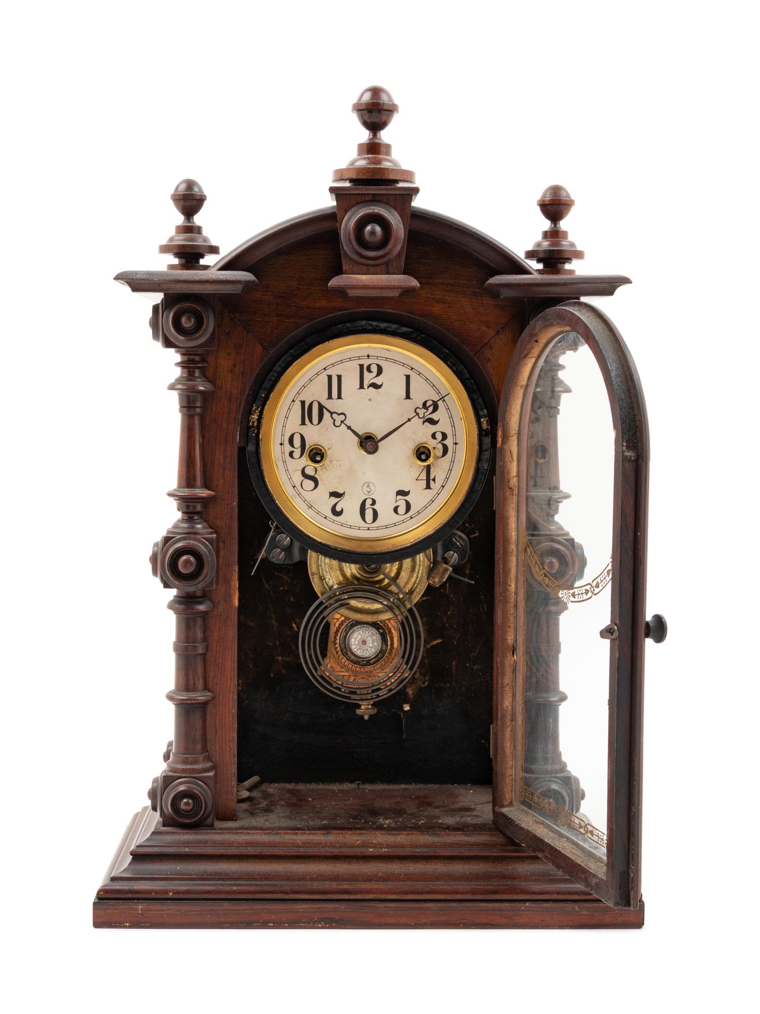 A Victorian Walnut Mantel Clock