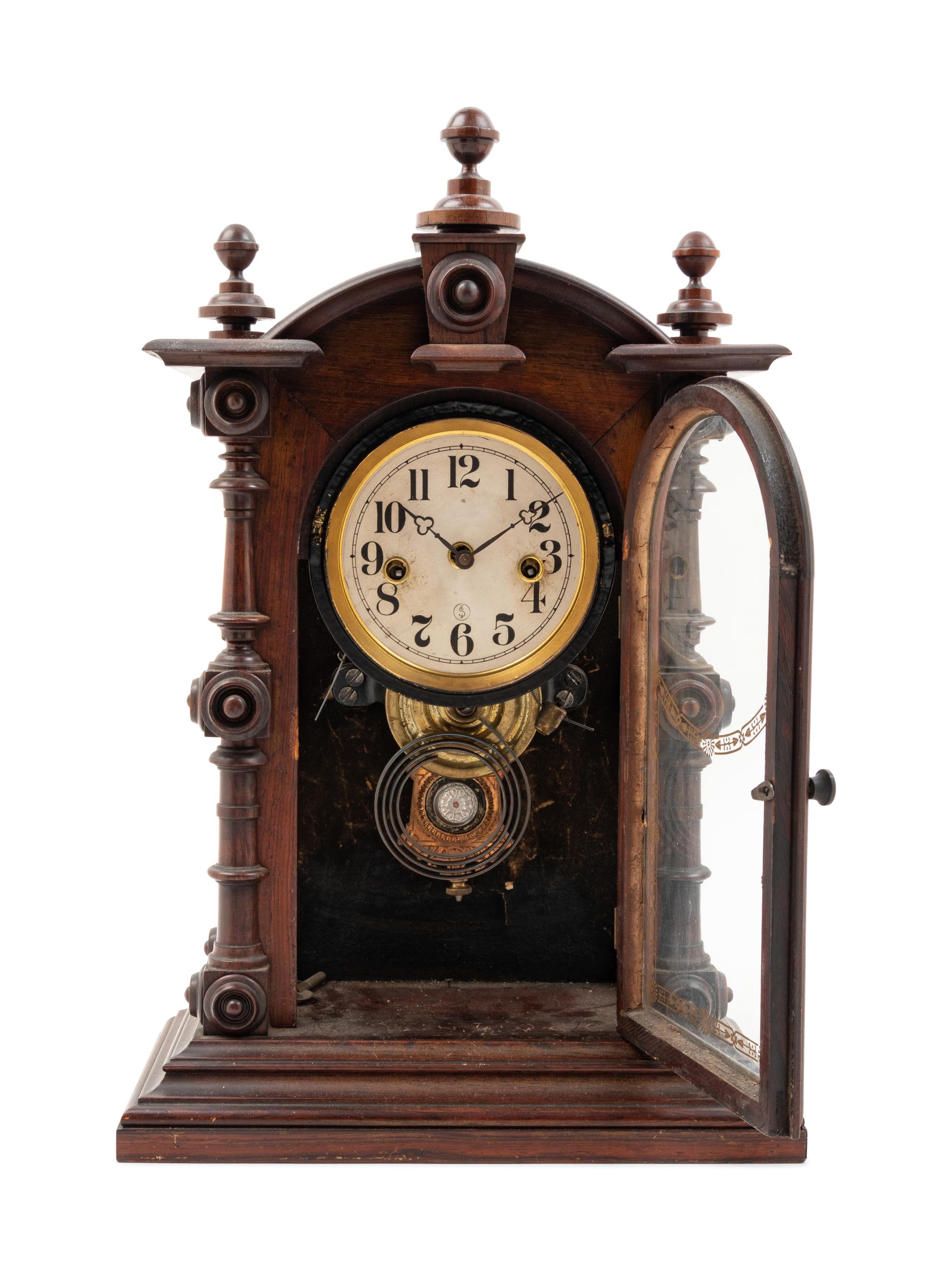 A Victorian Walnut Mantel Clock