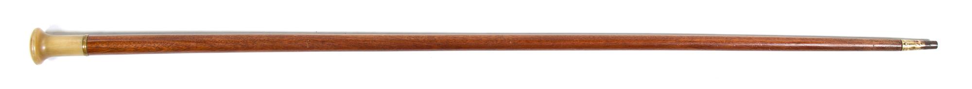 A Compass Inset Horn and Mahogany Walking Stick, Height overall 35 1/2 inches x diameter of handle 1 3/8 inches.