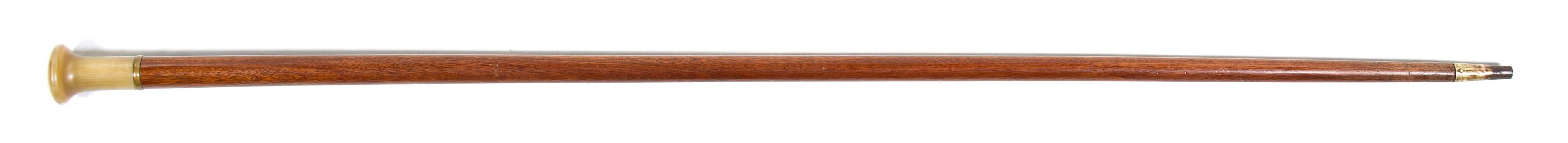 A Compass Inset Horn and Mahogany Walking Stick, Height overall 35 1/2 inches x diameter of handle 1 3/8 inches.