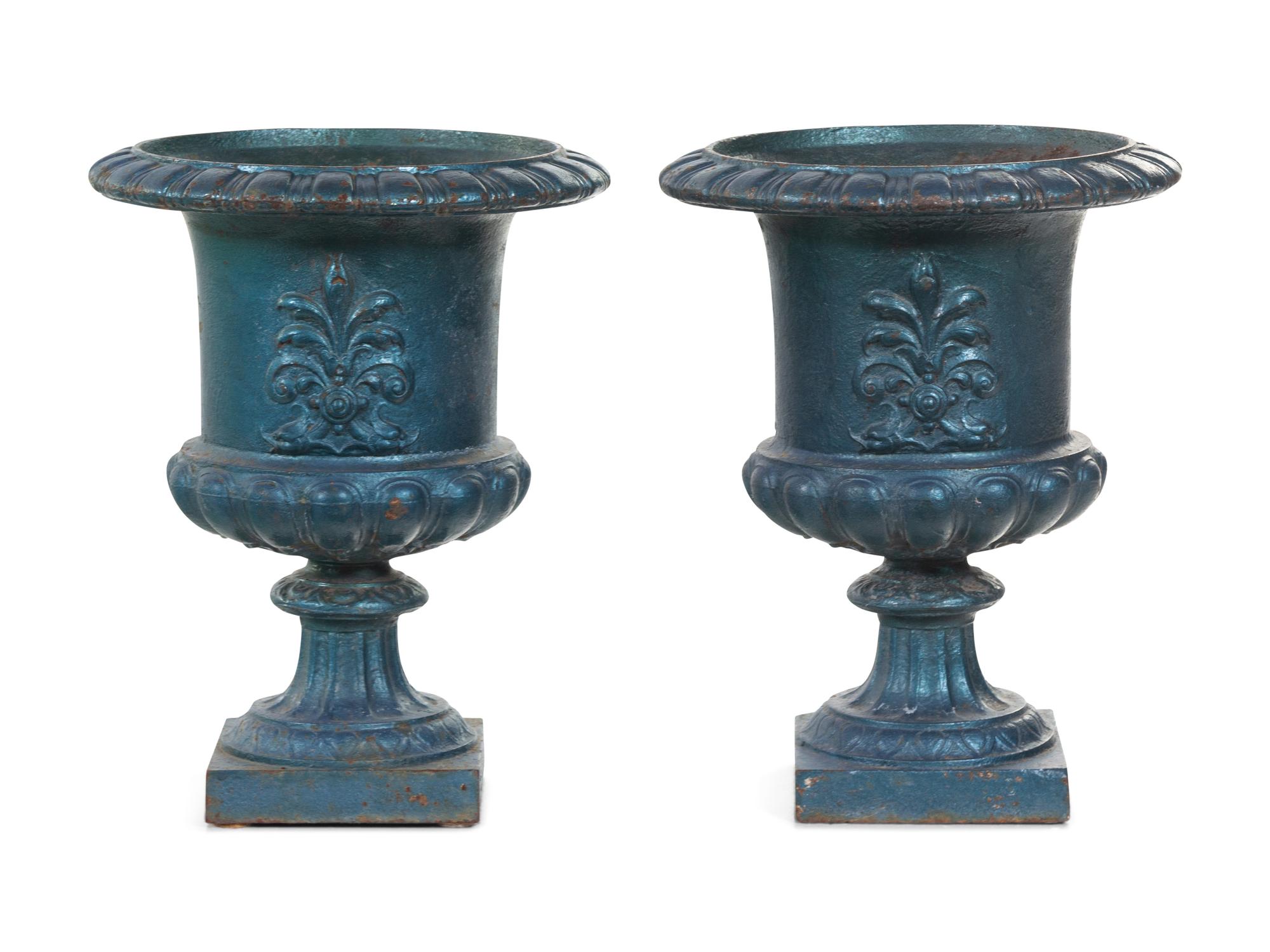 A Pair of Painted Iron Garden Urns