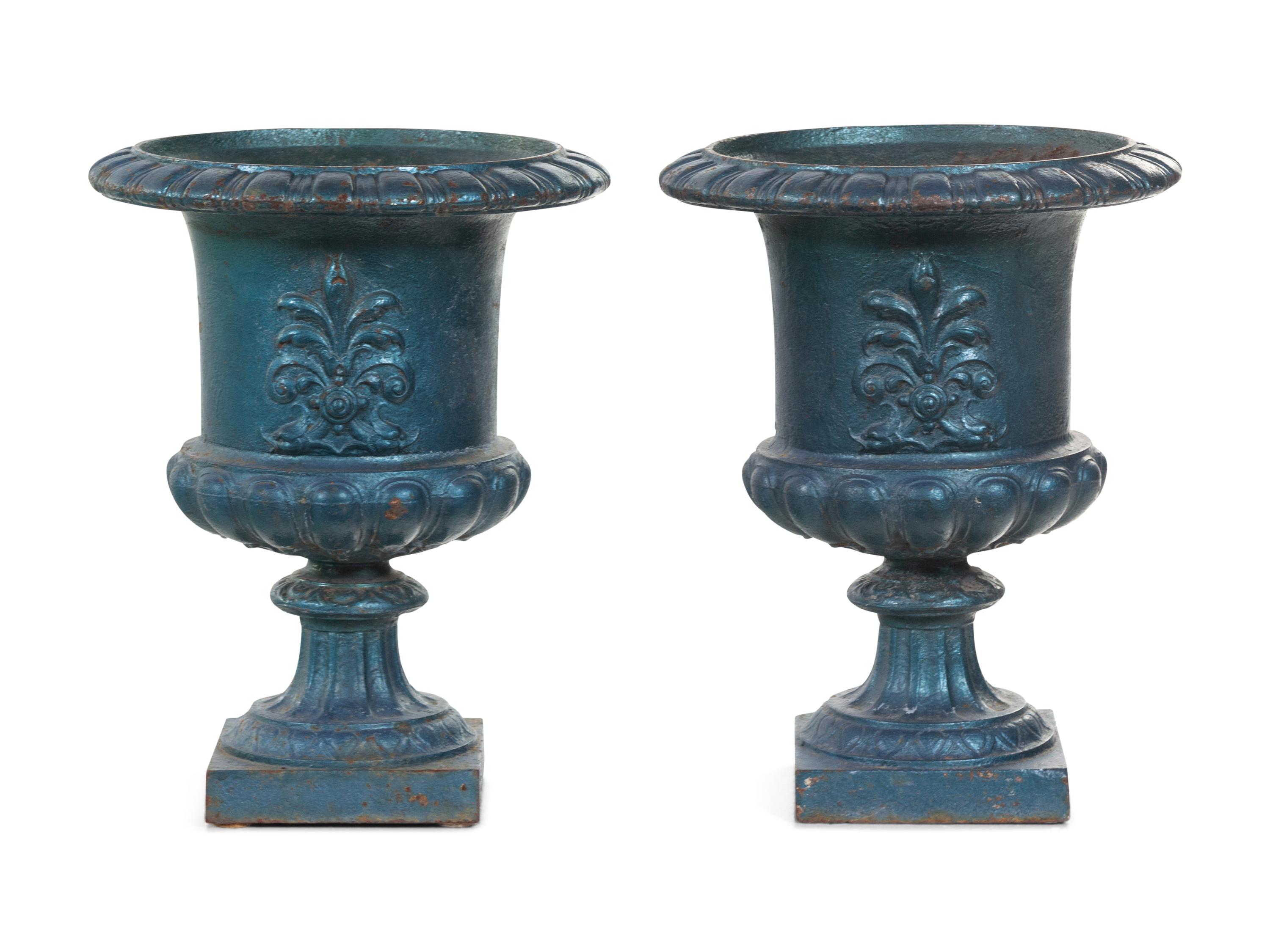 A Pair of Painted Iron Garden Urns