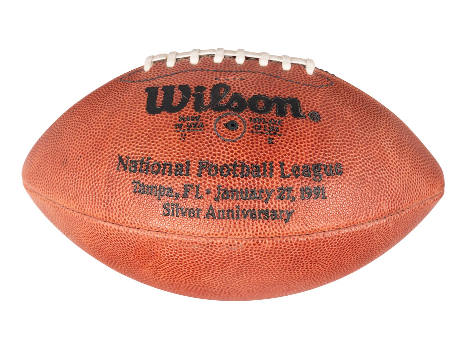 A Group of Eight Wilson Super Bowl Official Footballs and Promotional Poster,