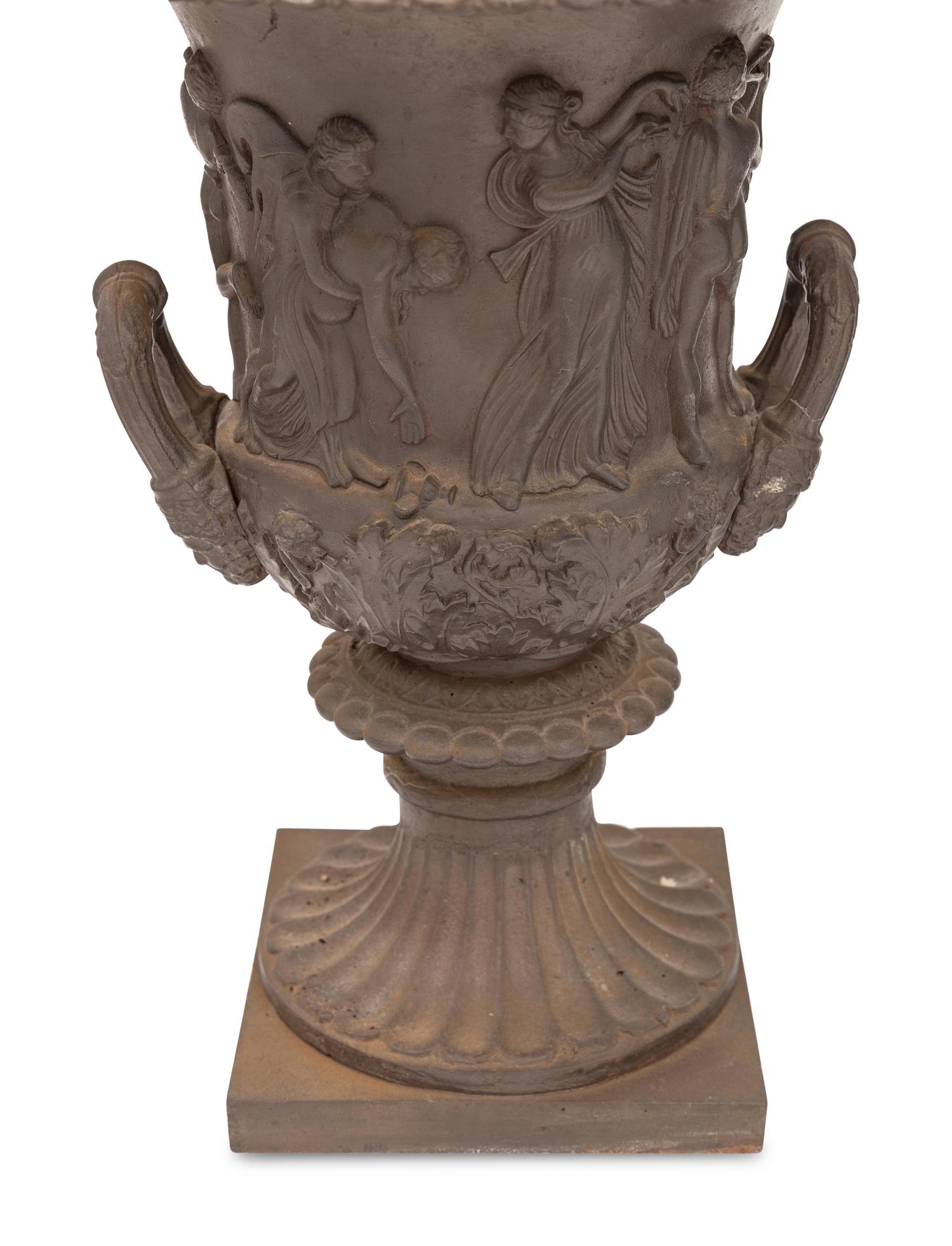 A Pair of Victorian Relief Decorated Cast Iron Garden Urns