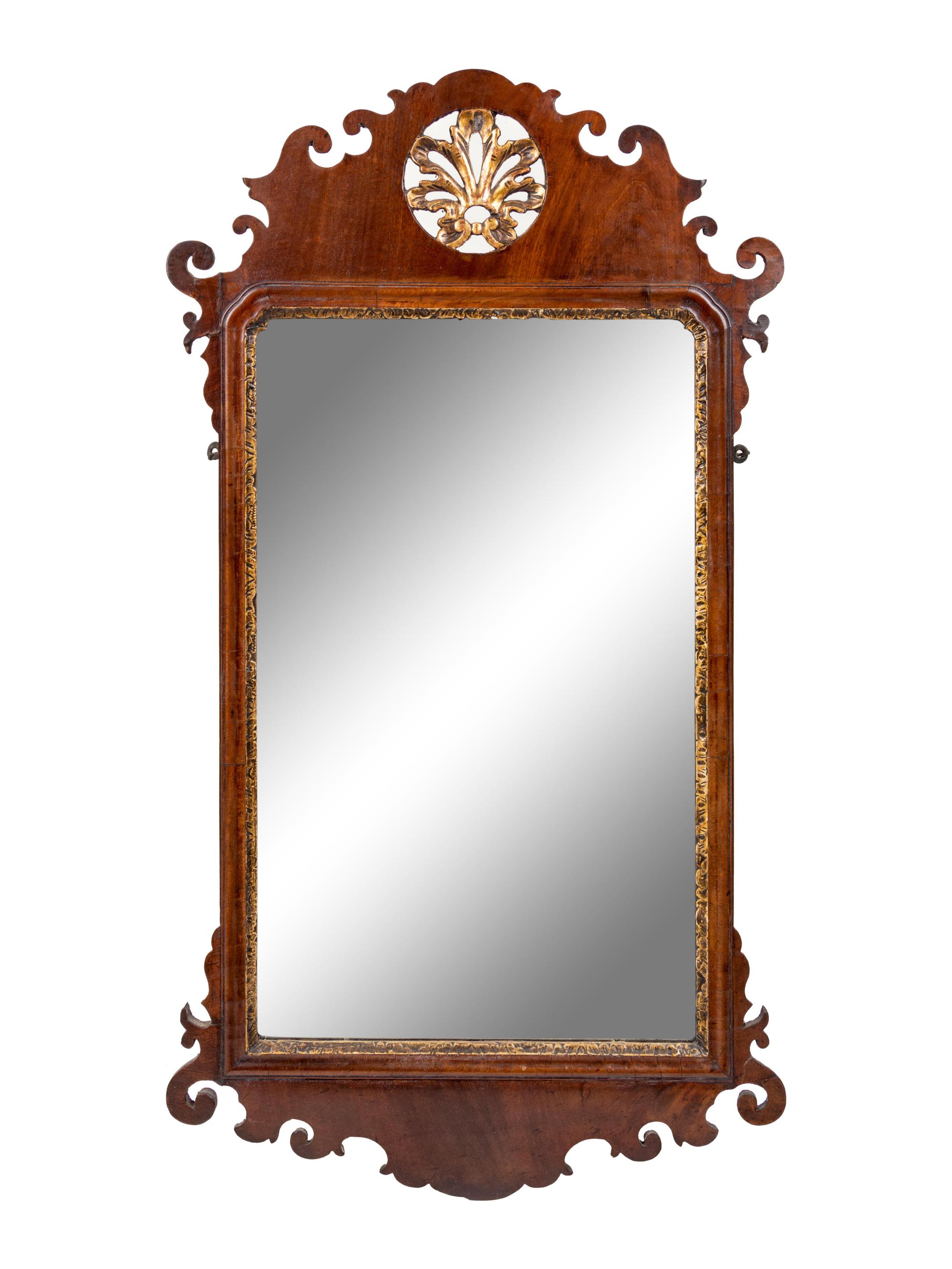 A Chippendale Style Carved and Parcel Gilt Mahogany Veneered Looking Glass