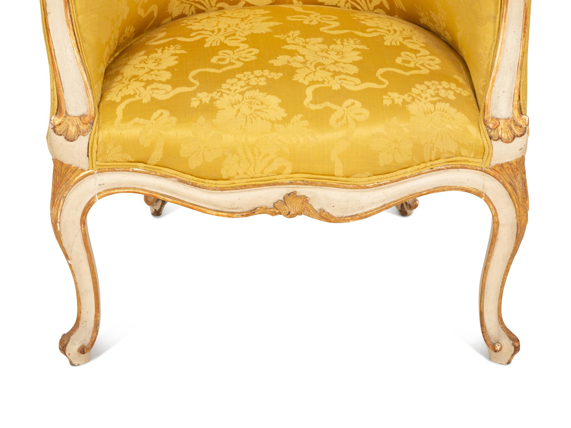 A Louis XV Style Painted and Parcel Gilt Barrel Back Bergere
