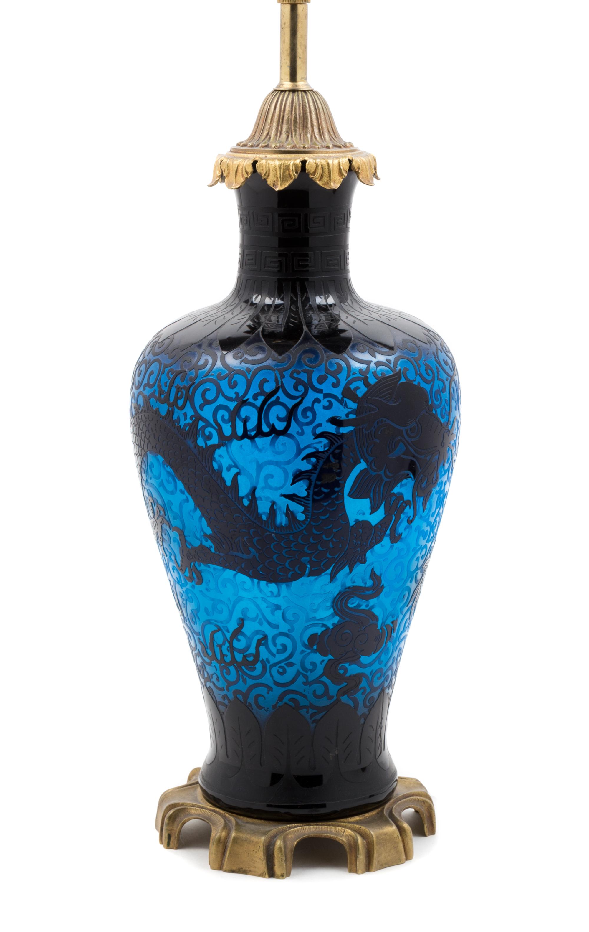 Steuben, 20TH CENTURY, a double etched dragon lamp, form no. 6094, in mirror black and celeste blue