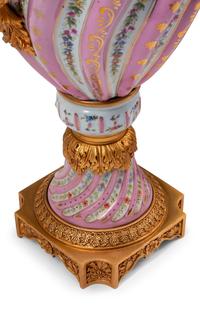 A Pair of Sèvres Style Gilt Bronze Mounted Porcelain Urns