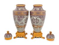A Pair of Continental Pâte-sur-Pâte Porcelain and Gilt-Bronze Mounted Covered Urns
