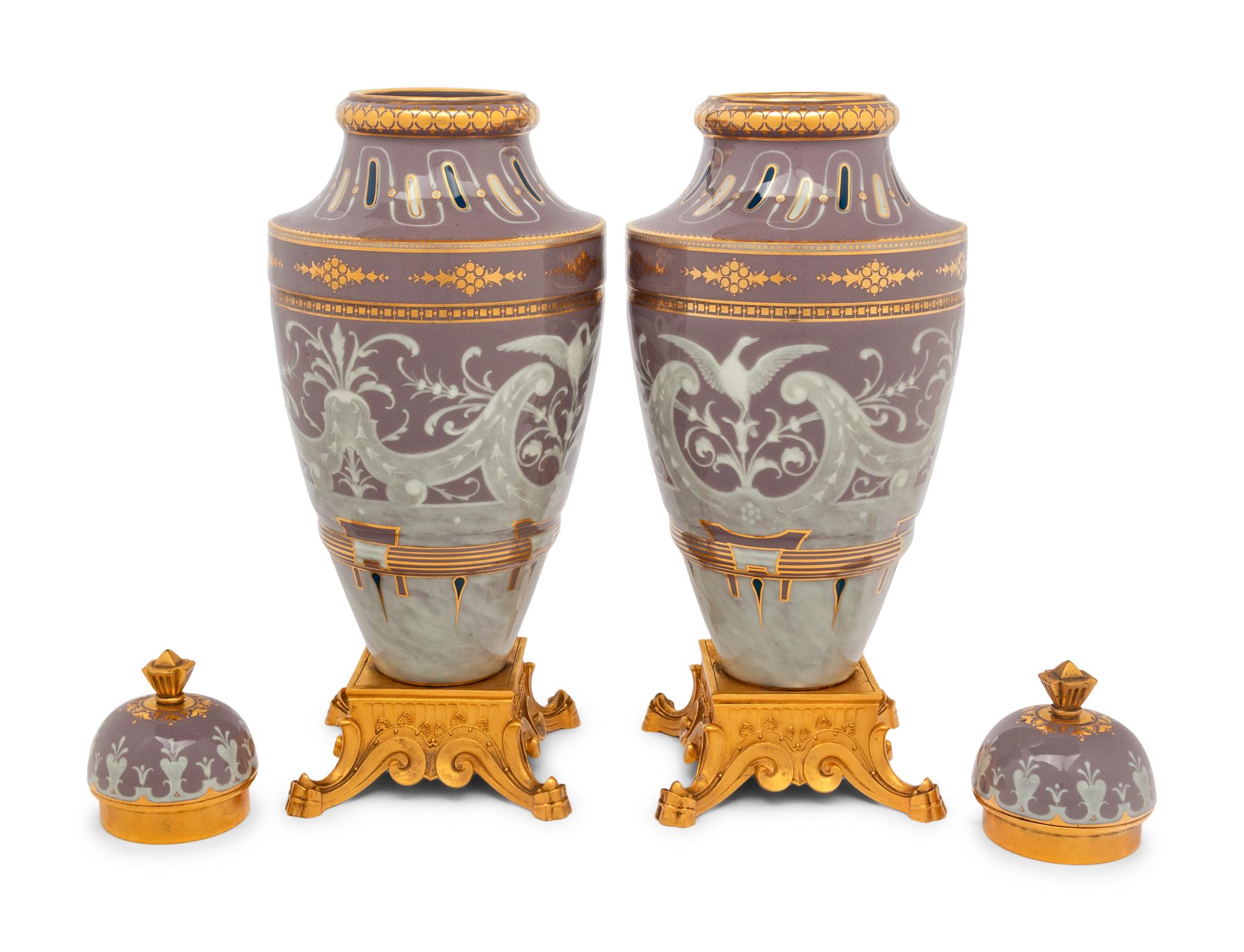 A Pair of Continental Pâte-sur-Pâte Porcelain and Gilt-Bronze Mounted Covered Urns