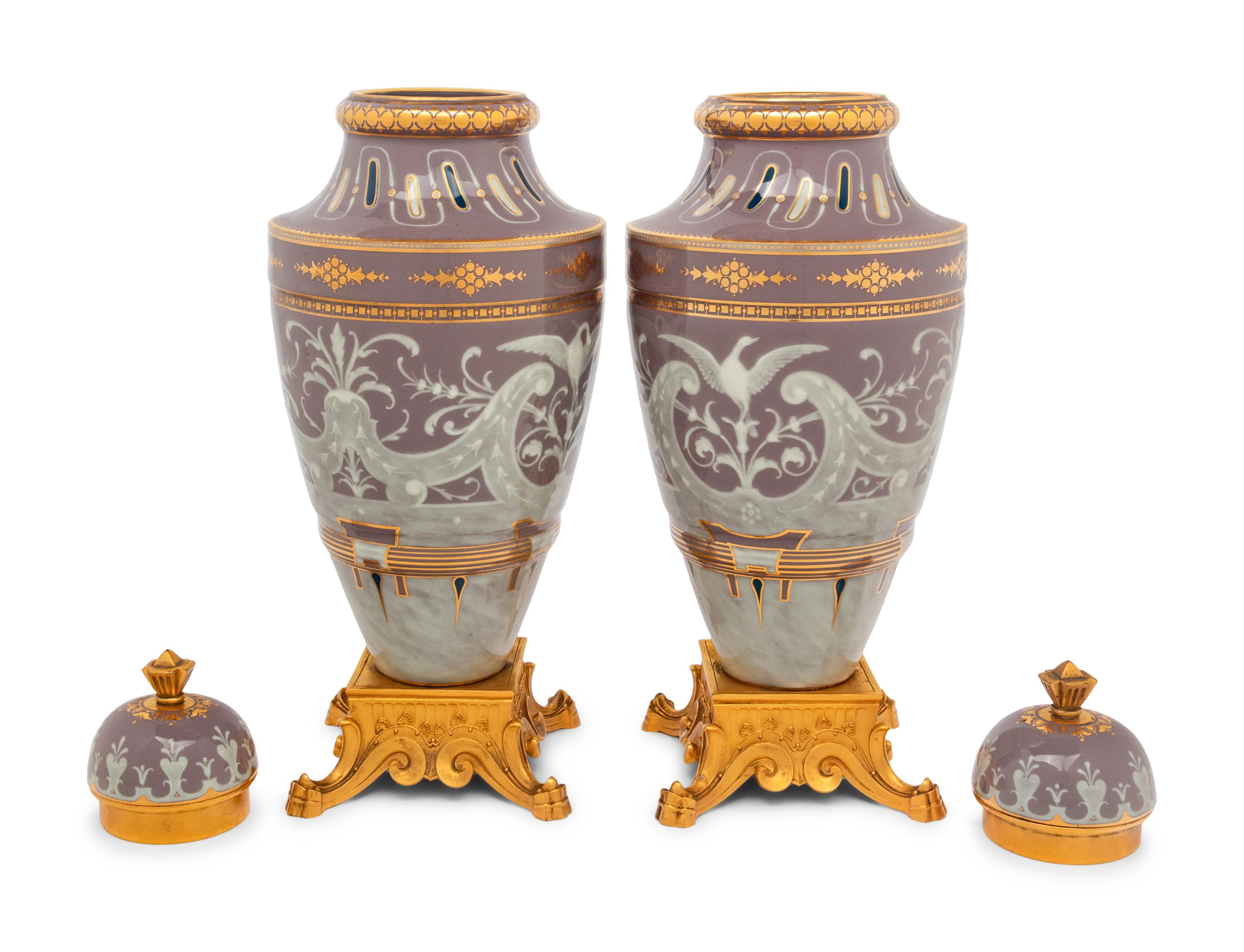 A Pair of Continental Pâte-sur-Pâte Porcelain and Gilt-Bronze Mounted Covered Urns