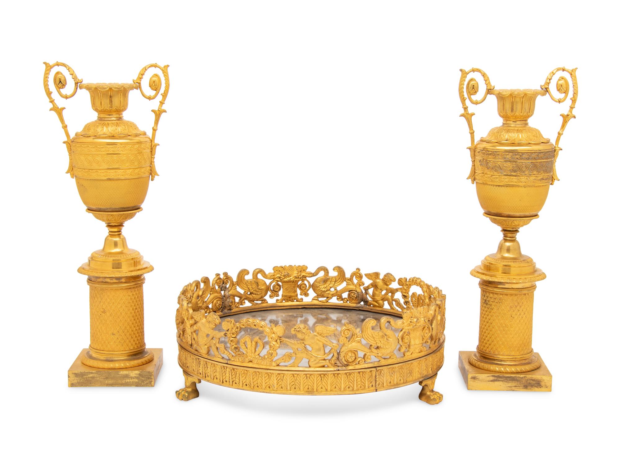 A Louis-Philippe Gilt Bronze Surtout de Table and a Pair of Restauration Gilt Bronze Urns