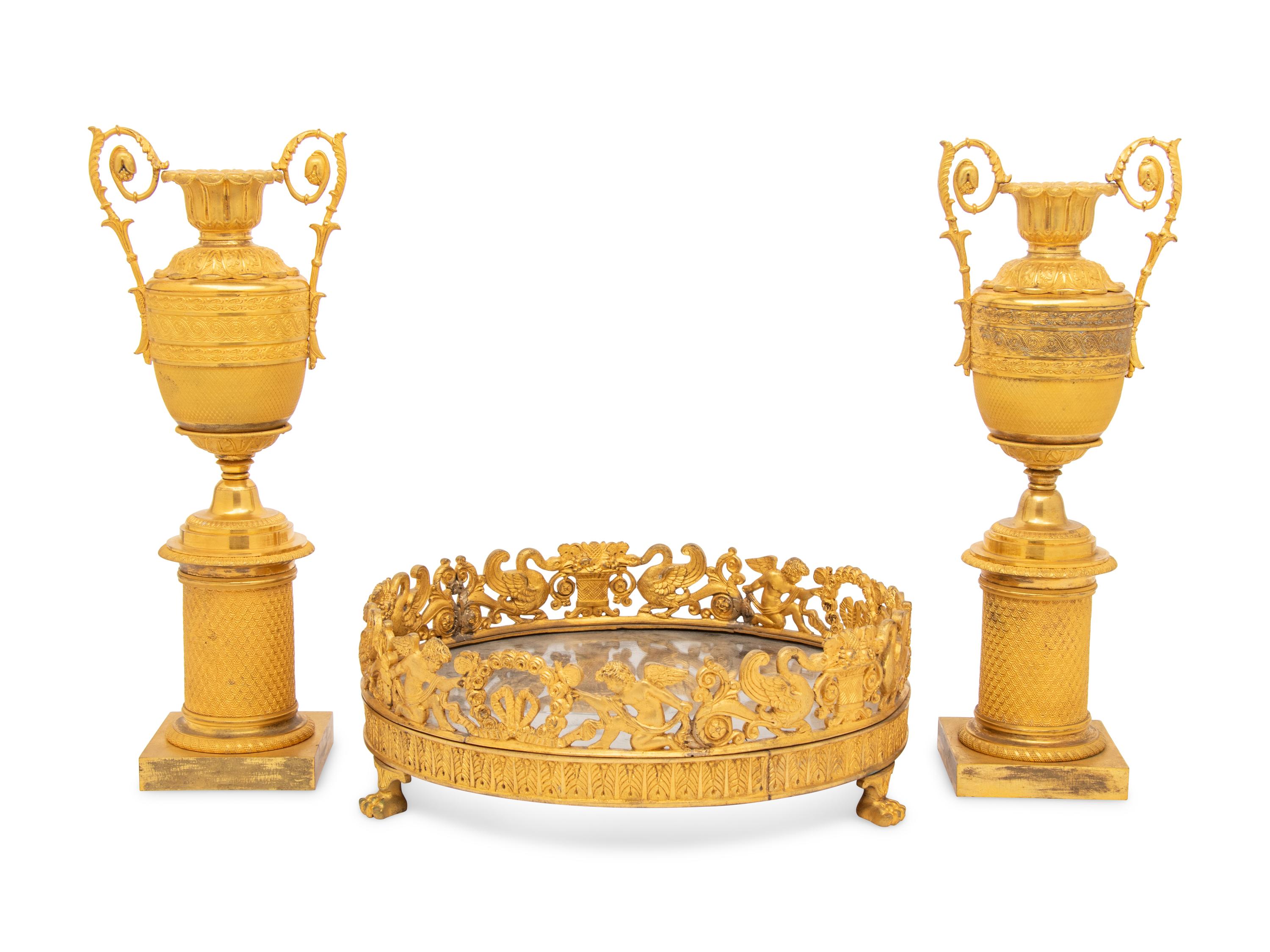 A Louis-Philippe Gilt Bronze Surtout de Table and a Pair of Restauration Gilt Bronze Urns