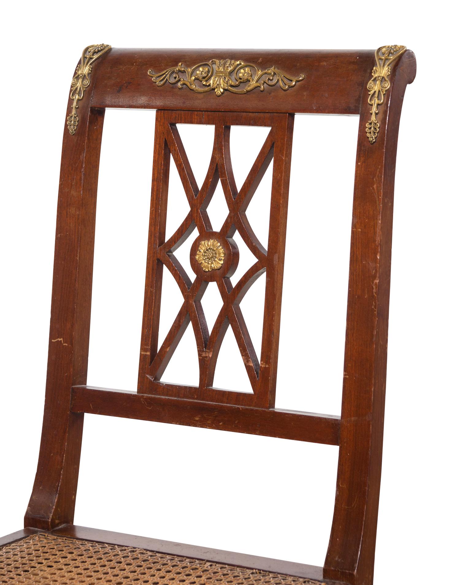 An Assembled Empire Style Gilt Metal Mounted Mahogany Dining Suite