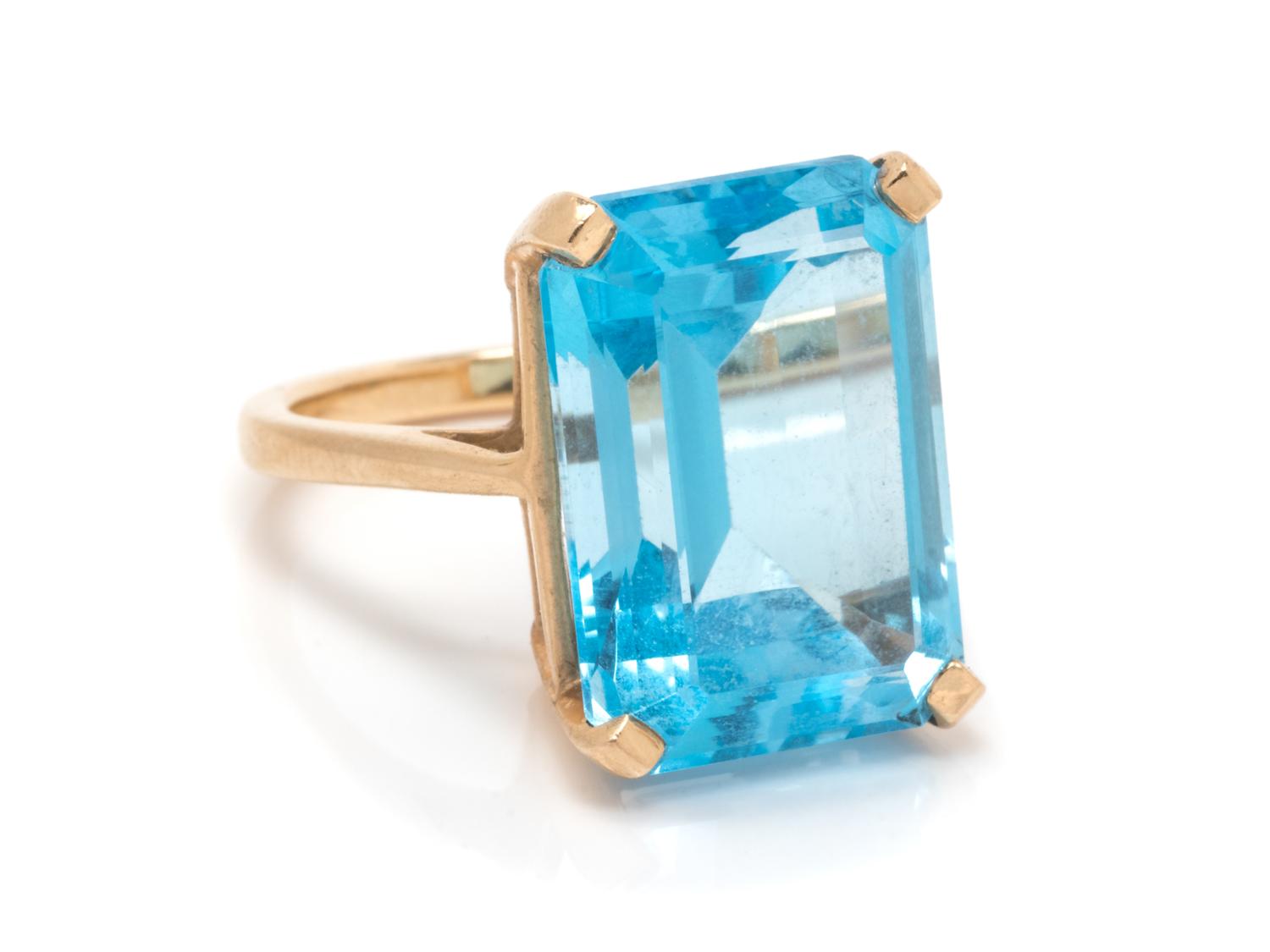 A 14 Karat Yellow Gold and Topaz Ring,