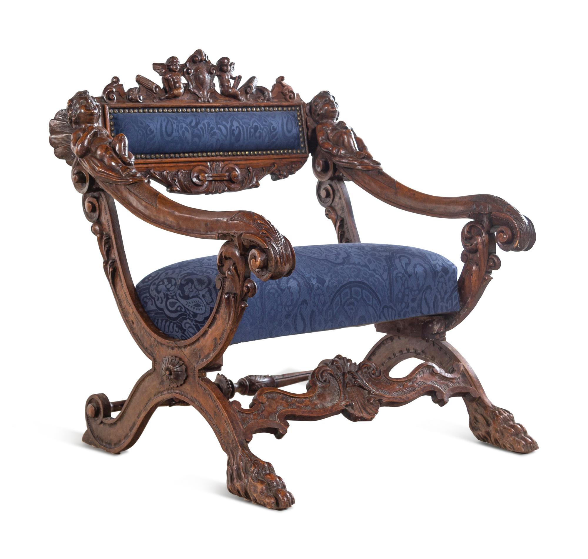A Pair of Italian Renaissance Style Carved Walnut Armchairs
