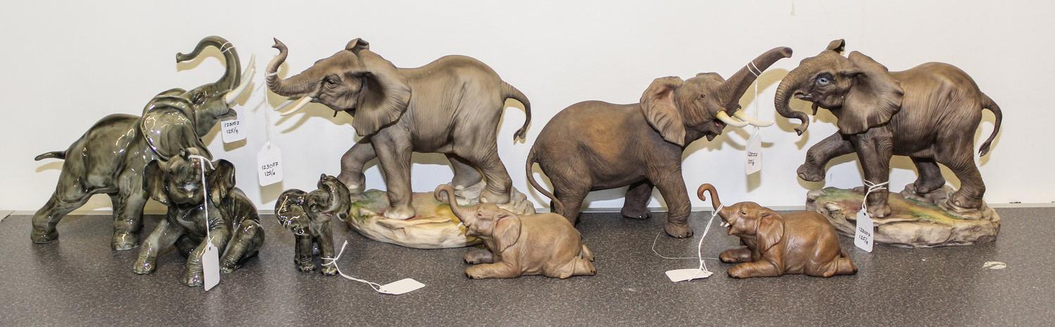 A Group of Eight Porcelain Elephant Figures Height of tallest 8 inches.