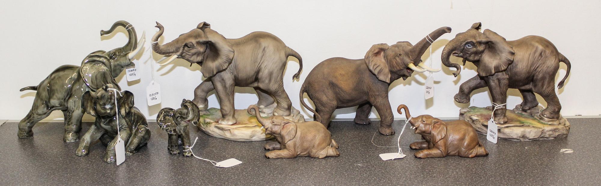A Group of Eight Porcelain Elephant Figures Height of tallest 8 inches.