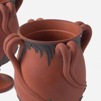 A Pair of Wedgwood Black Basaltes-Decorated Rosso Antico "Tendril" Vases UK, circa 1800