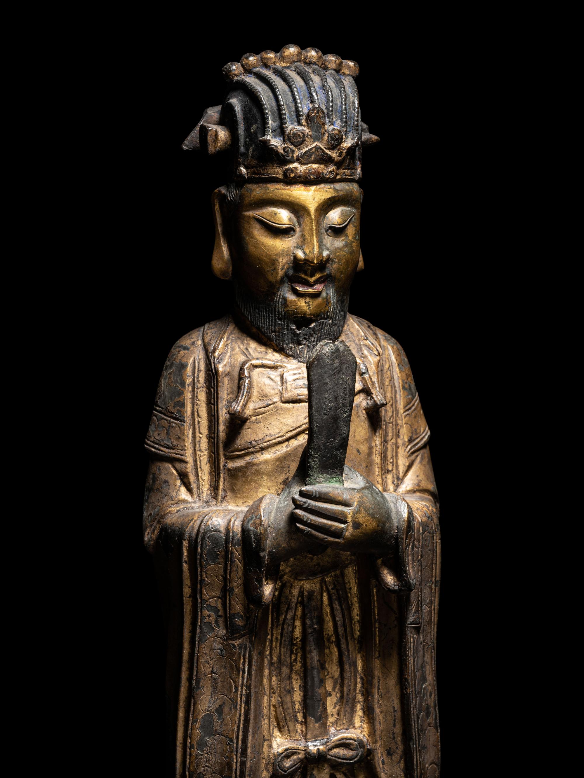 A Pair of Chinese Gilt Decorated Bronze Figures of Standing Officials