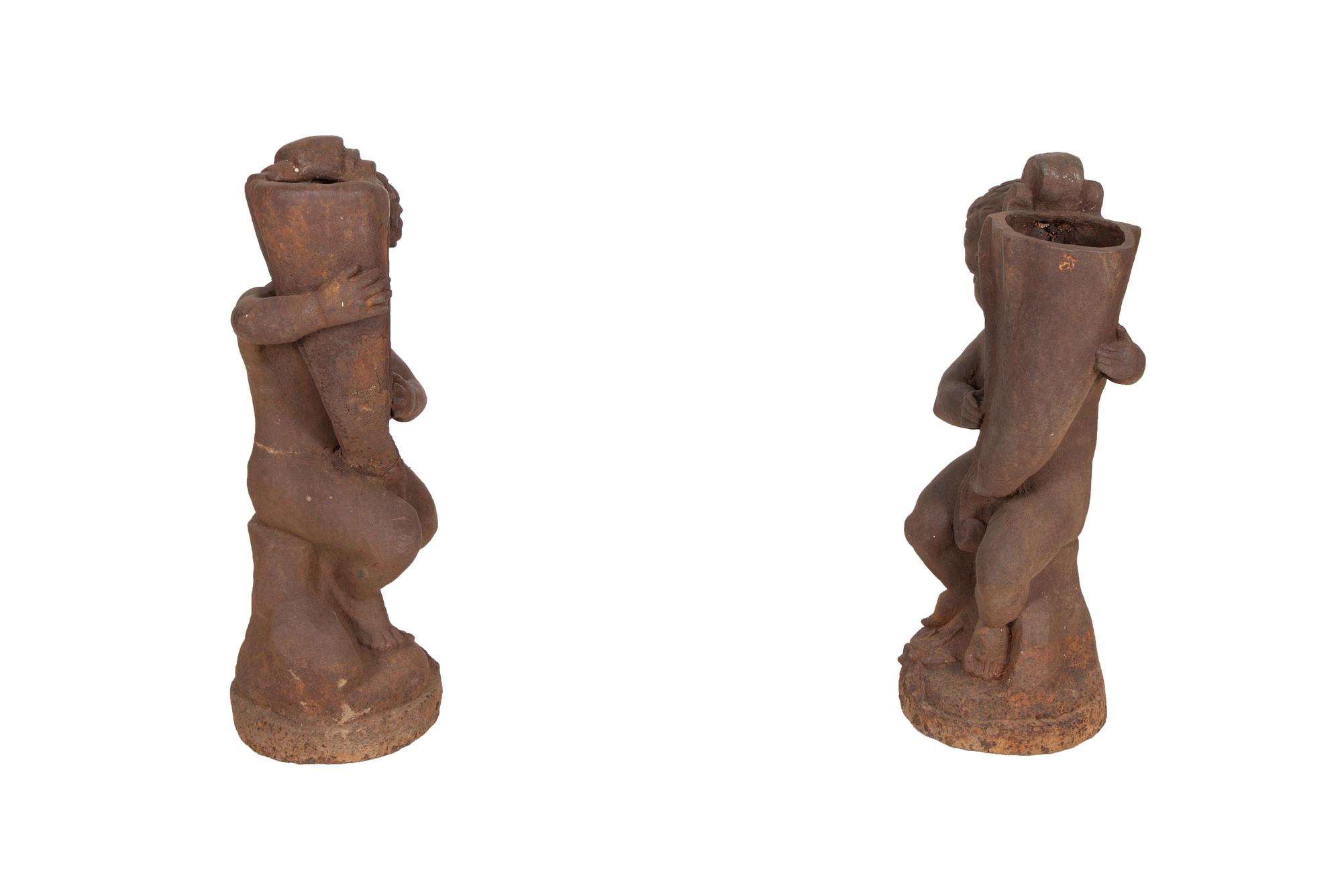 A Pair of Cast Iron Garden Cherubs