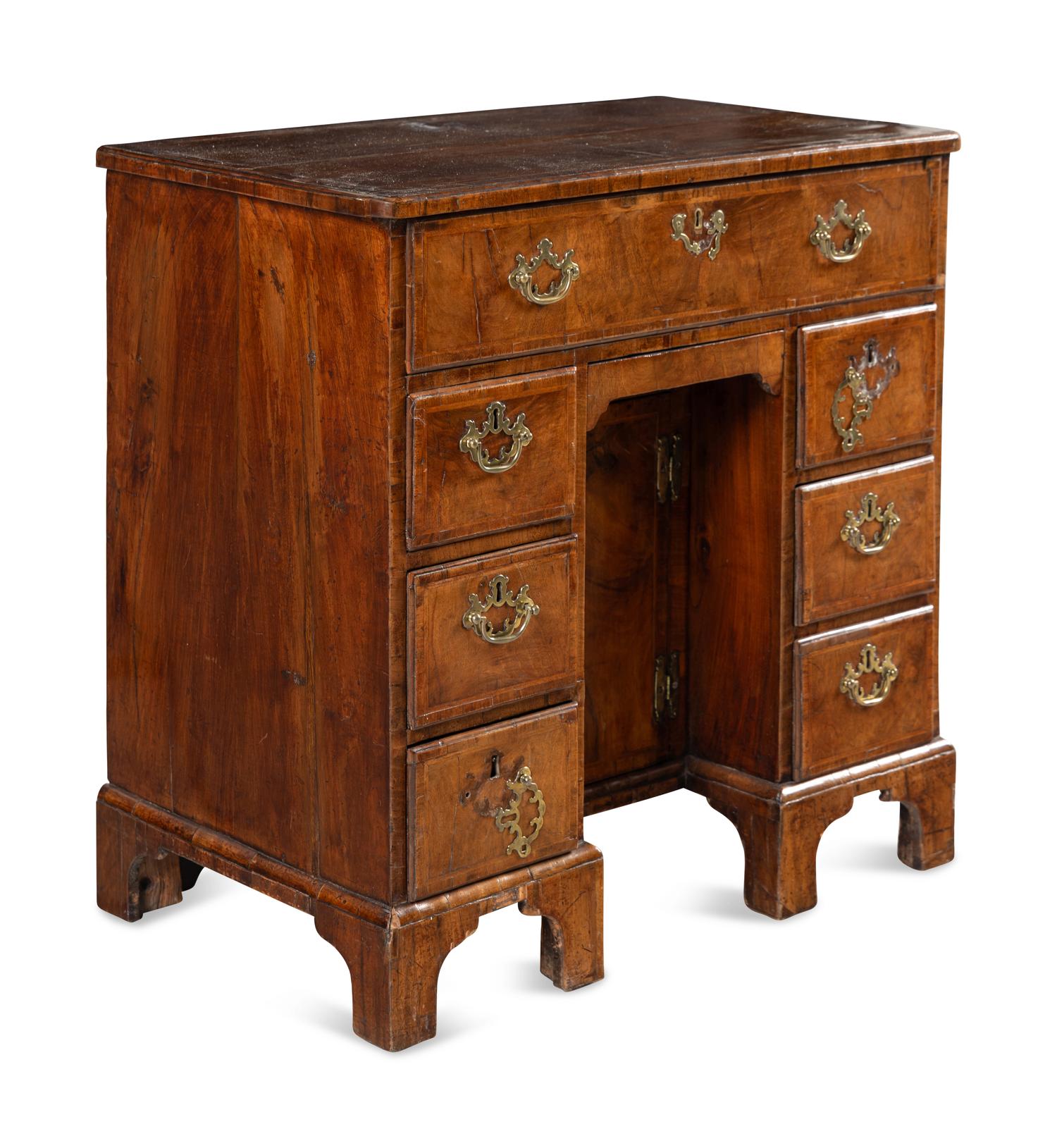 A George II Walnut Kneehole Desk