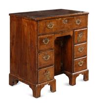 A George II Walnut Kneehole Desk