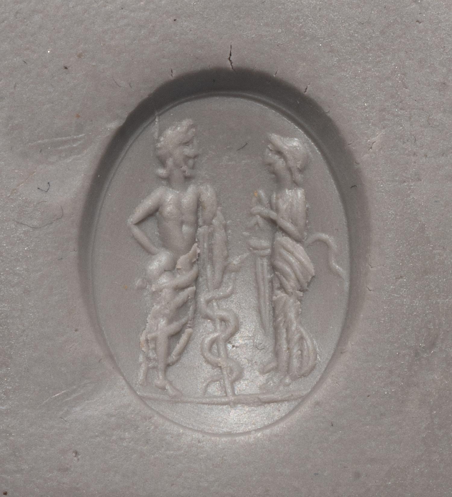 A Roman Carnelian Ring Stone with the God Asclepius and a Satyr