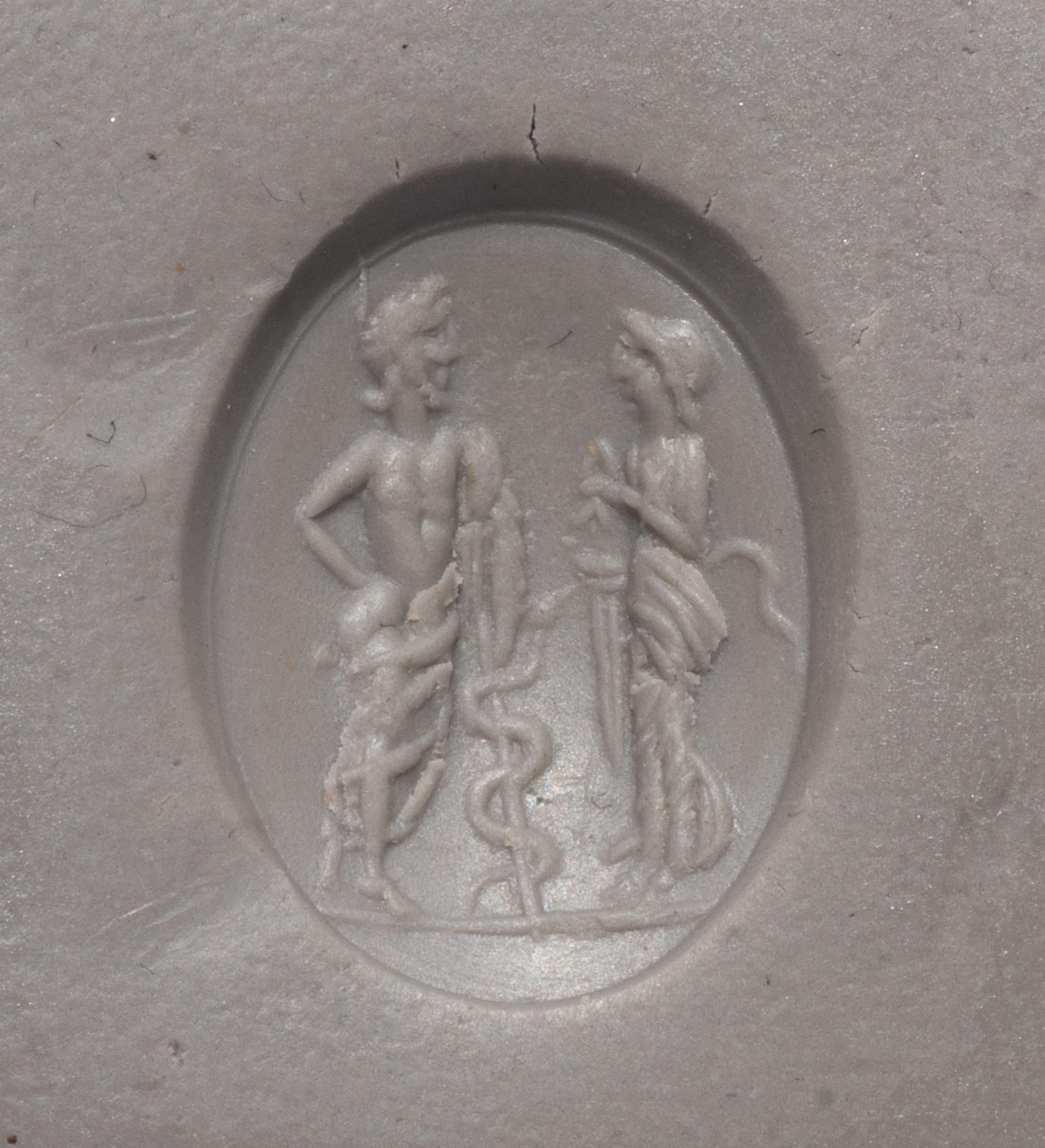A Roman Carnelian Ring Stone with the God Asclepius and a Satyr