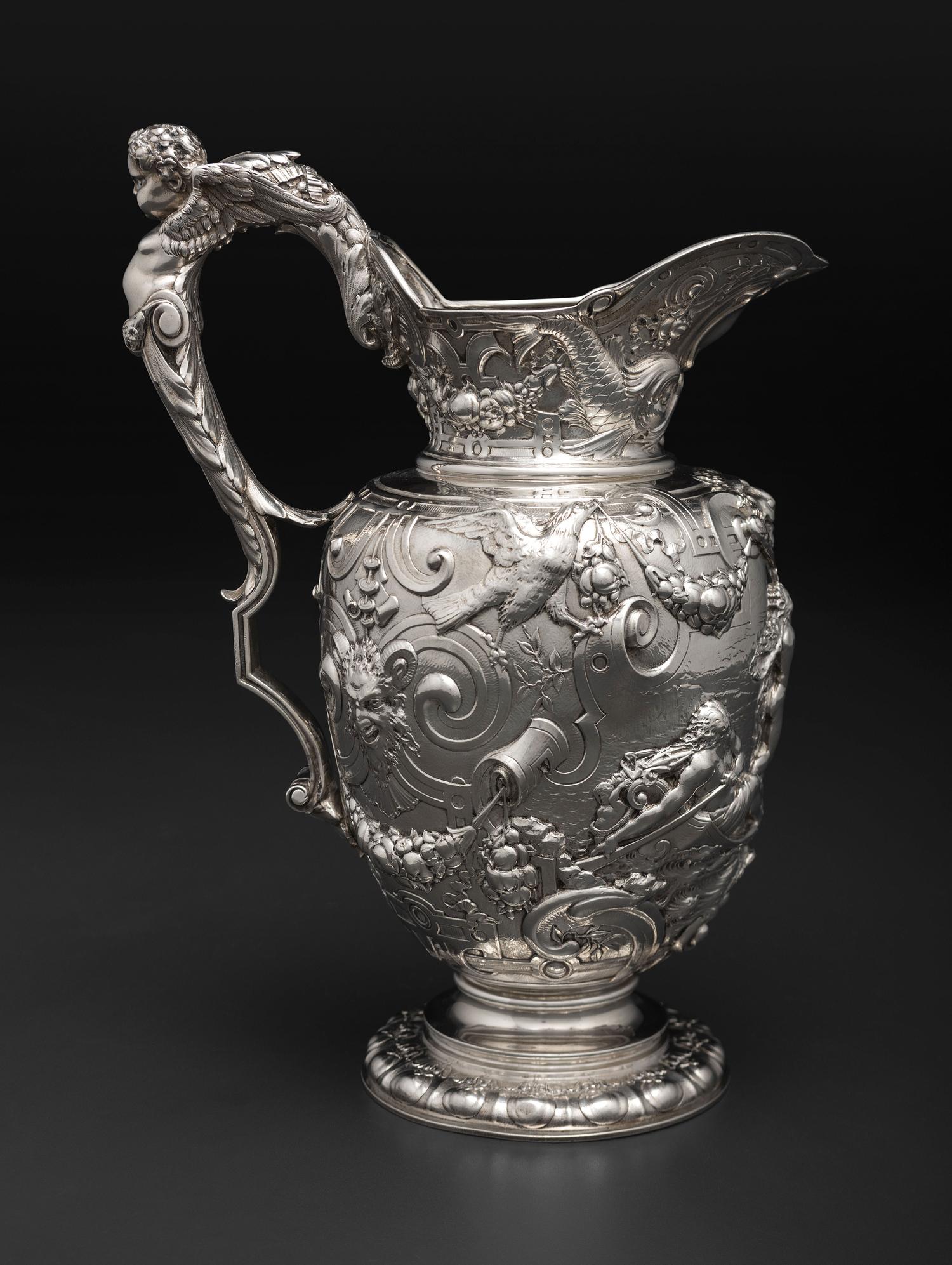 An American Baroque Style Repousse Silver Pitcher